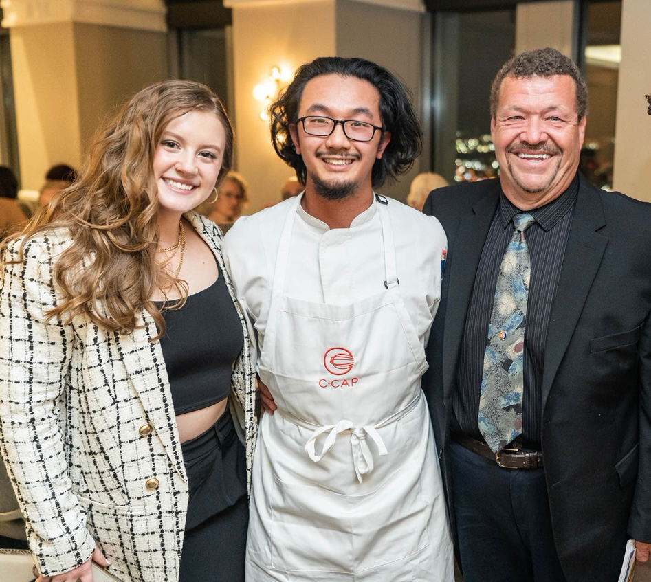 Culinary arts student Natalie Mrak posed with two others at a conference 